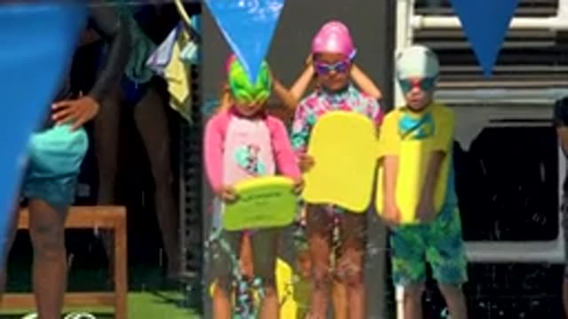 CABO SAN LUCAS MEXICO-2020: Small Children Wearing Colorful Swimsuits Patiently Waiting to Jump
