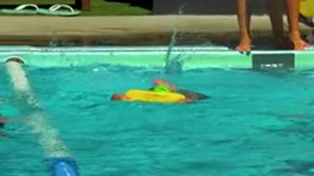 CABO SAN LUCAS MEXICO-2020: A Child Learning To Swim With Face In The Water And