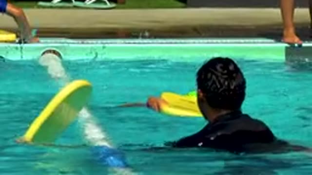 CABO SAN LUCAS MEXICO-2020: Young Smart Boy Swimming In The Clean Pool Wearing Black Swimsuit