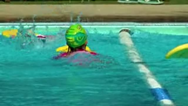 CABO SAN LUCAS MEXICO-2020: Some Children Learn To Swim In A Pool Wearing