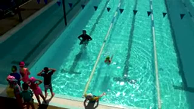 CABO SAN LUCAS MEXICO-2020: A Child Swimming In A Pool Supervised By An Adult