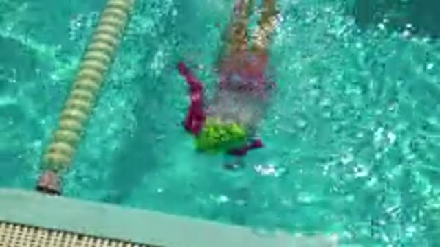 CABO SAN LUCAS MEXICO-2020: Young Girl Swimming Towards Lap Pool Edge