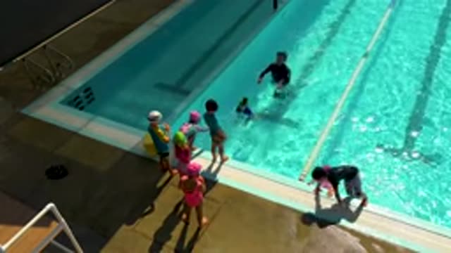 CABO SAN LUCAS MEXICO-2020: Instructor Teaches Children How To Dive And Swim