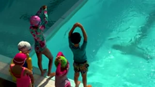 CABO SAN LUCAS MEXICO-2020: Young Female and Male Kids Learning to Dive in Pool