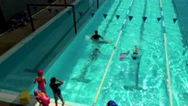 CABO SAN LUCAS MEXICO-2020: Children Line Up Practicing Swim Drills with Coach