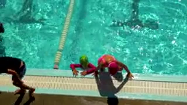 CABO SAN LUCAS MEXICO-2020: Children Climbing Out Of Pool After Swimming Laps