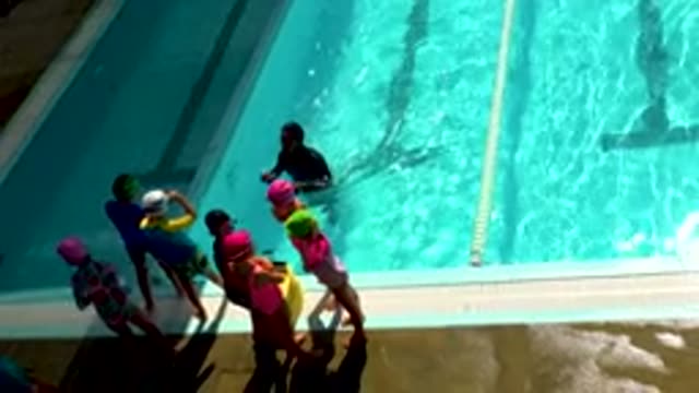 CABO SAN LUCAS MEXICO-2020: Cute Young Children Standing Near The Clean Water
