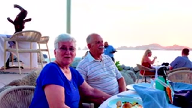Senior Couple Dining At Outdoor Restaurant