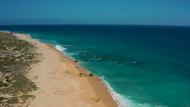 EL CARDONCITO BCS MEXICO-2020: Aerial View Of Ocean Waves Gently Rolling Onto