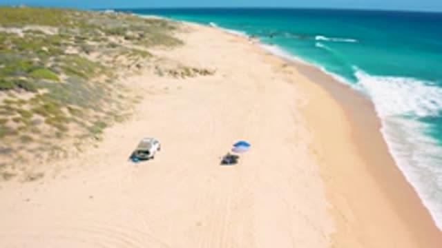 EL CARDONCITO BCS MEXICO-2020: A Vehicle And A Lone Umbrella And Towel Set