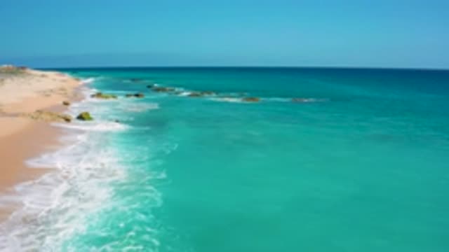 EL CARDONCITO BCS MEXICO-2020: Waves Crashing Into Sandy Beach