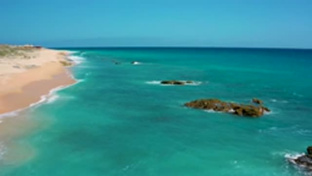EL CARDONCITO BCS MEXICO-2020: Aerial View Of Blue Deserted Beach With Some