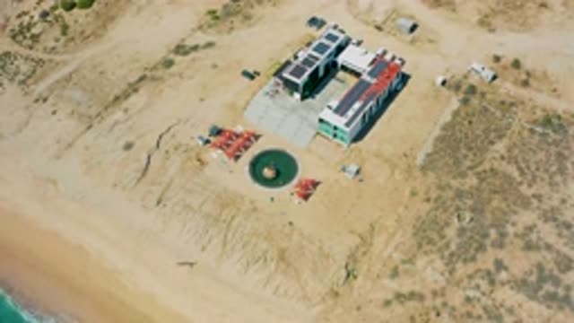 EL CARDONCITO BCS MEXICO-2020: A Building Sits On The Beach Near The Surf With