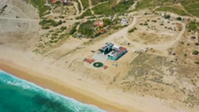EL CARDONCITO BCS MEXICO-2020: Zoom Out Shot Of Mansion Surrounded By Sand And Greenery