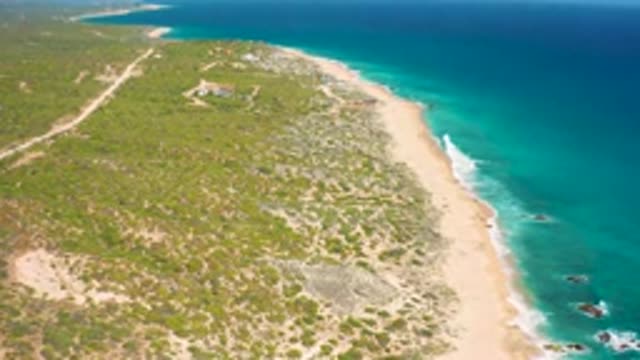 EL CARDONCITO BCS MEXICO-2020: Blue Waves Wash Against Sandy Coast Fading Into