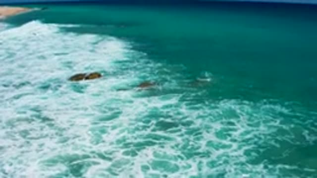 EL CARDONCITO BCS MEXICO-2020: Dark Blue Water Washes Against Rocks And Beach