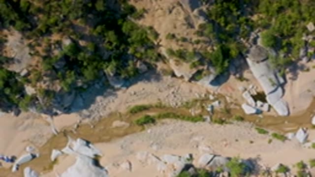 LA PALMA BCS MEXICO-2020: Aerial View Of Sandy Ravine Bordered By Rocks And Trees