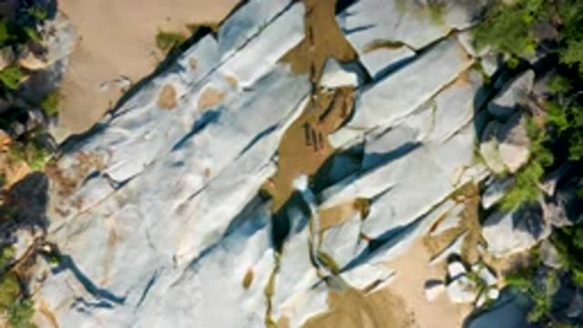 LA PALMA BCS MEXICO-2020: People Walk Between Grey Rocks On Sand With Sparse