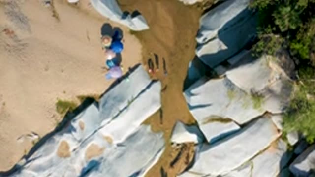 LA PALMA BCS MEXICO-2020: People With Umbrellas Walking Around In The Sand By