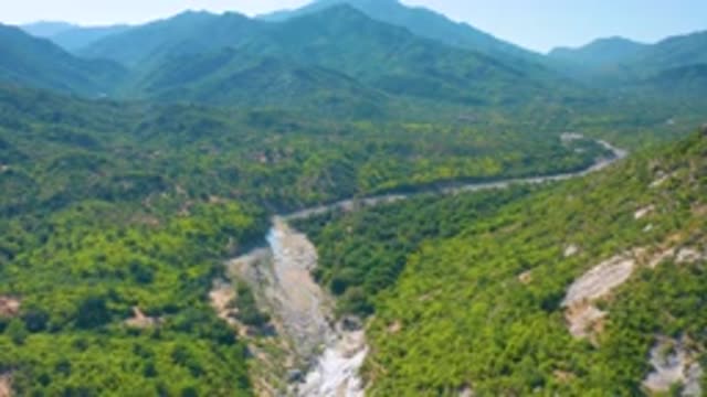 LA PALMA BCS MEXICO-2020: River Valley Between Forested Mountains In A Misty Sky