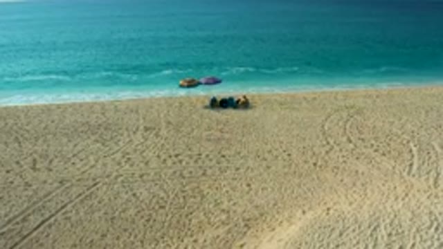 DESERT PARK NATURAL RESERVE BAJA CALIFORNIA SUR MEXICO-2020: Aerial View of People Relaxing on Sandy Beach
