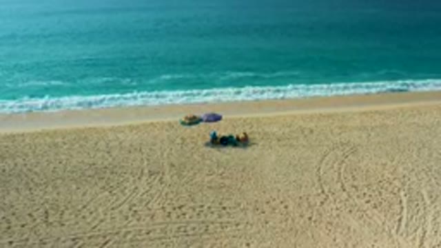 DESERT PARK NATURAL RESERVE BAJA CALIFORNIA SUR MEXICO-2020: Aerial View of Beachgoers Relaxing on Sand