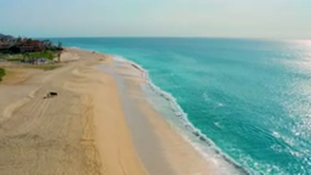 DESERT PARK NATURAL RESERVE BAJA CALIFORNIA SUR MEXICO-2020: Aerial View Of Turquoise Ocean Waves Washing Over Sandy Beach