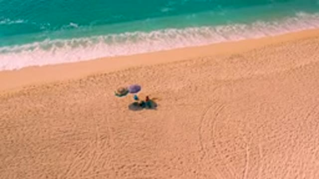 DESERT PARK NATURAL RESERVE BAJA CALIFORNIA SUR MEXICO-2020: Aerial View of Couple Relaxing on Sandy Beach