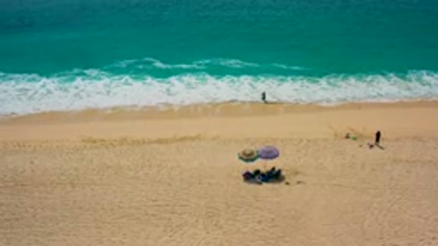 DESERT PARK NATURAL RESERVE BAJA CALIFORNIA SUR MEXICO-2020: Aerial View of Beachgoers Relaxing on Sandy Shore
