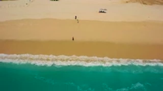 DESERT PARK NATURAL RESERVE BAJA CALIFORNIA SUR MEXICO-2020: Aerial View Of Beachgoers Walking Along Sandy Shore