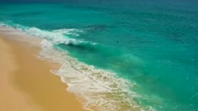 DESERT PARK NATURAL RESERVE BAJA CALIFORNIA SUR MEXICO-2020: Aerial View Of Turquoise Waves Crashing On Sandy Beach