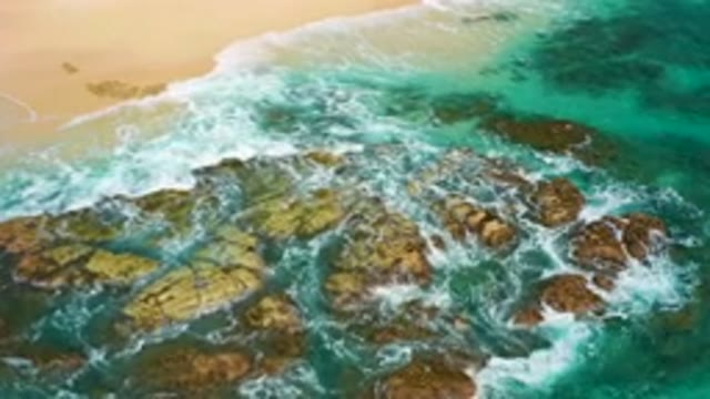 DESERT PARK NATURAL RESERVE BAJA CALIFORNIA SUR MEXICO-2020: Aerial View Of Turquoise Waves Crashing On Rocky Shore