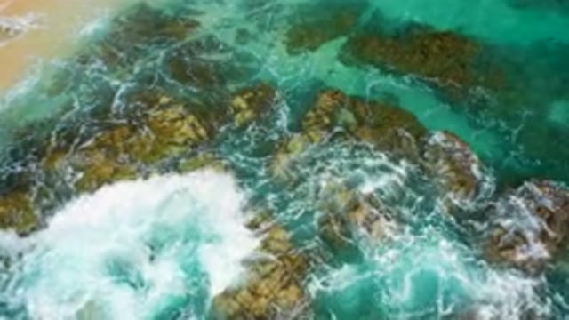 DESERT PARK NATURAL RESERVE BAJA CALIFORNIA SUR MEXICO-2020: Aerial View Of Turquoise Waves Crashing On Rocky Coast