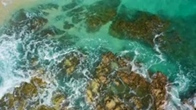 DESERT PARK NATURAL RESERVE BAJA CALIFORNIA SUR MEXICO-2020: Aerial View Of Turquoise Waves Crashing On Rocky Coast