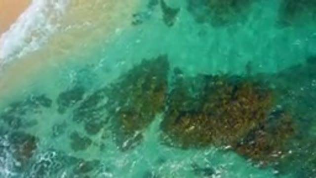 DESERT PARK NATURAL RESERVE BAJA CALIFORNIA SUR MEXICO-2020: Aerial View Of Turquoise Waves Crashing On Rocky Shore