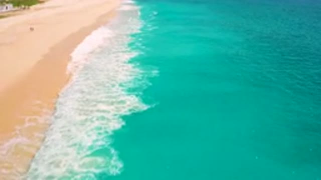DESERT PARK NATURAL RESERVE BAJA CALIFORNIA SUR MEXICO-2020: Aerial View Of Turquoise Waves Washing Over Sandy Beach