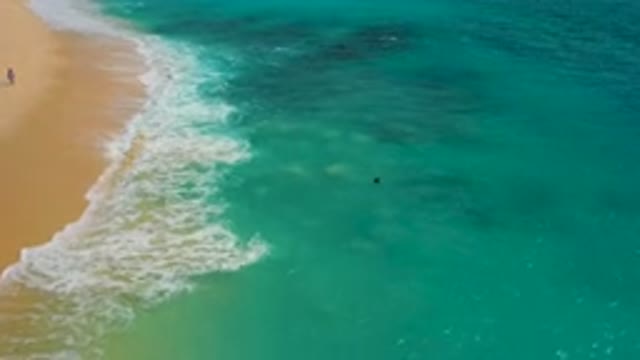 DESERT PARK NATURAL RESERVE BAJA CALIFORNIA SUR MEXICO-2020: Aerial View of Turquoise Ocean Waves Crashing on Sandy Beach