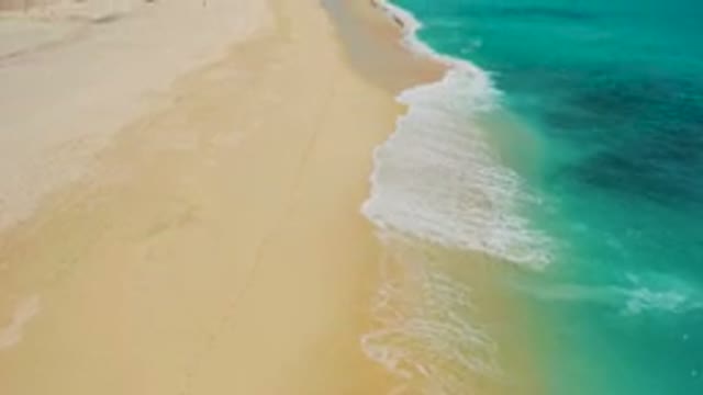 DESERT PARK NATURAL RESERVE BAJA CALIFORNIA SUR MEXICO-2020: Aerial View Of Turquoise Ocean Waves Washing Over Sandy Beach